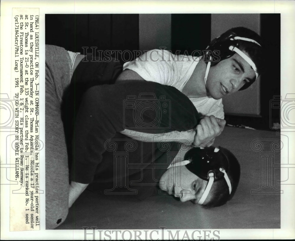 1991 Press Photo Brian Nicola has his practice partner, Ryan Surmay well in hand - Historic Images