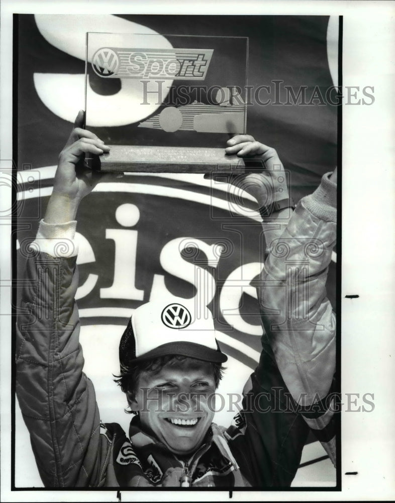 1986 Press Photo Didier they holds trophy aloft after winning Super Vee race - Historic Images