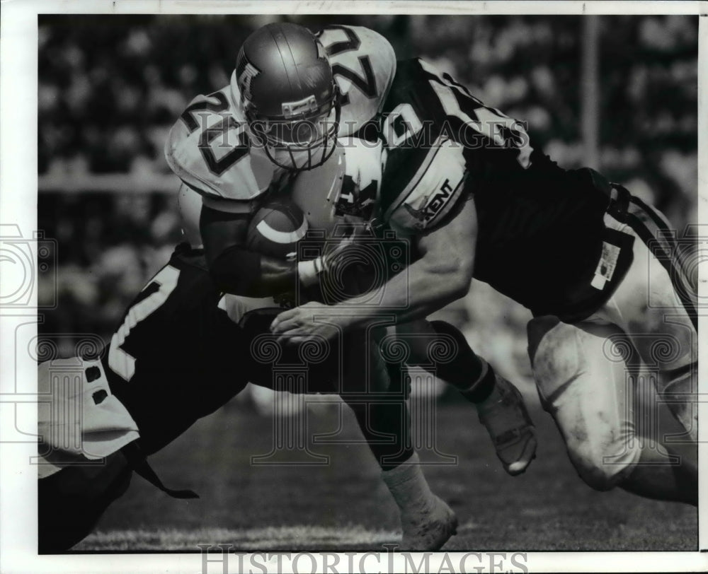 1990 Press Photo Doug Lewis, TB of Akron gets tackled - cvb47420 - Historic Images