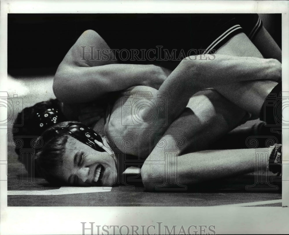 1989 Press Photo Chad Gron of St. Joseph tries with all his strength to get out - Historic Images