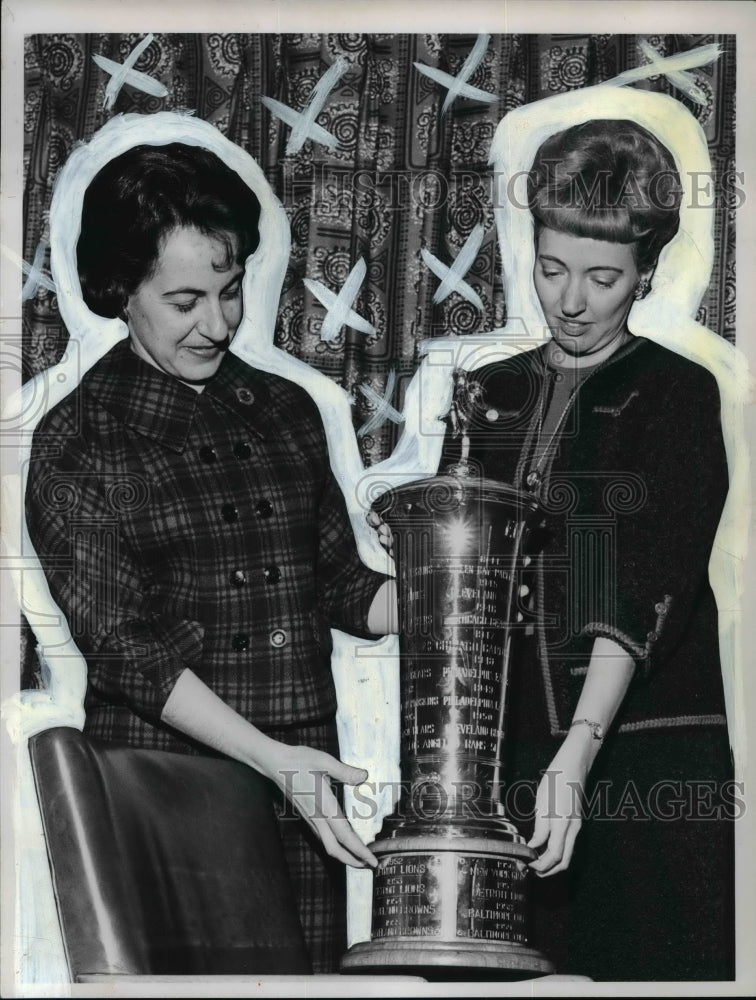 1965 Gerry Gargiulo and Carlyn Jacobson looking at the NFL trophy-Historic Images