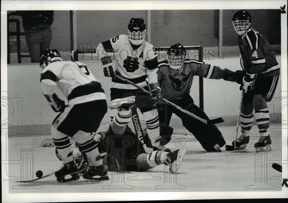 1984 Press Photo Bob Saada takes over the puck North Olmsted player falls - Historic Images