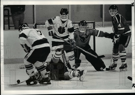 1984 Press Photo Bob Saada takes over the puck North Olmsted player falls - Historic Images