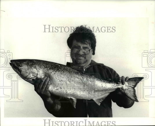 Bill Woods, of Euclid, holding the 44-inch, 28 pound King Salmon Press Photo - Historic Images