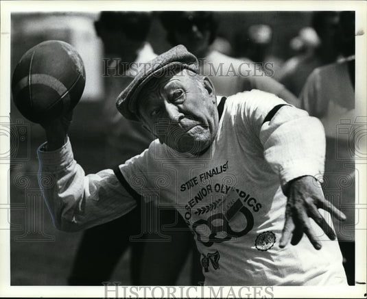 Press Photo Anthony Slazas-football throw event, Ohio Senior Olympics - Historic Images