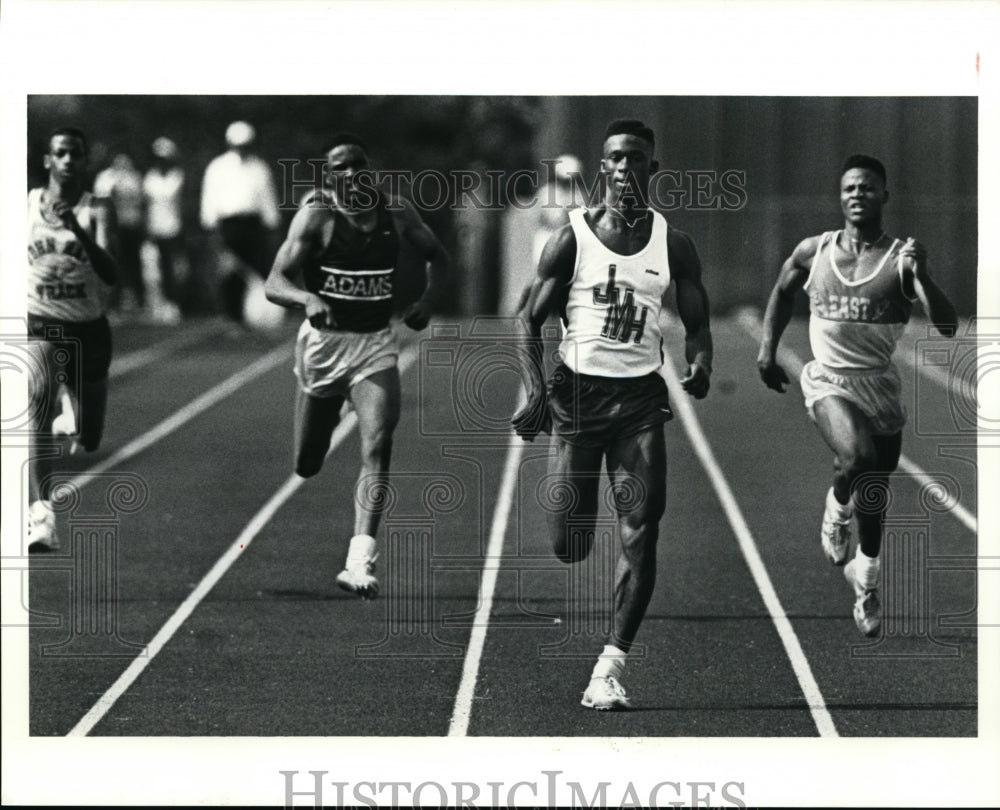 1991 Press Photo Jonathan Burrell of John Marshall High during 100m meter race - Historic Images