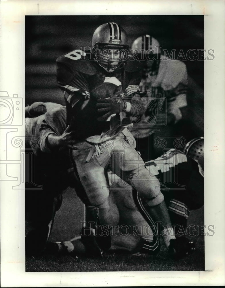 Press Photo John Wilhelm, Mentor, passes Dan Bainbride, Maple Heights football. - Historic Images