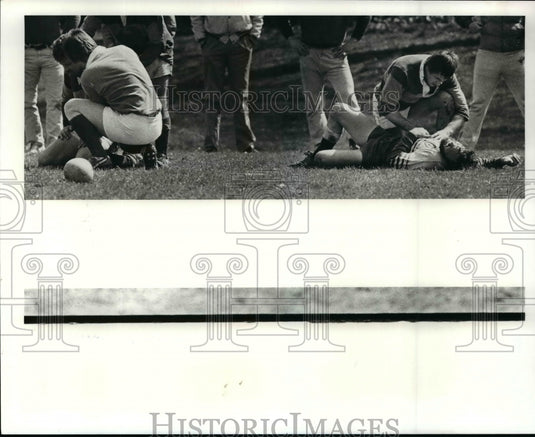 Press Photo Scioto player Steve Finkel helping Rover's Jim Gorie. - cvb53968 - Historic Images