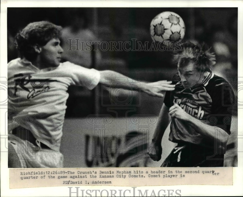 Press Photo The Crunch's Dennis Mepham hits a header against Comets player - Historic Images