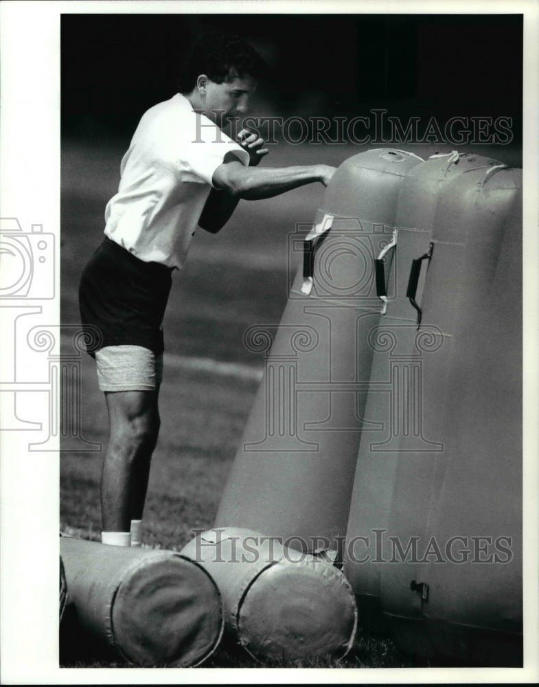 1990 Press Photo Tackling dummies become boxing opponents for Greg Beggiani - Historic Images