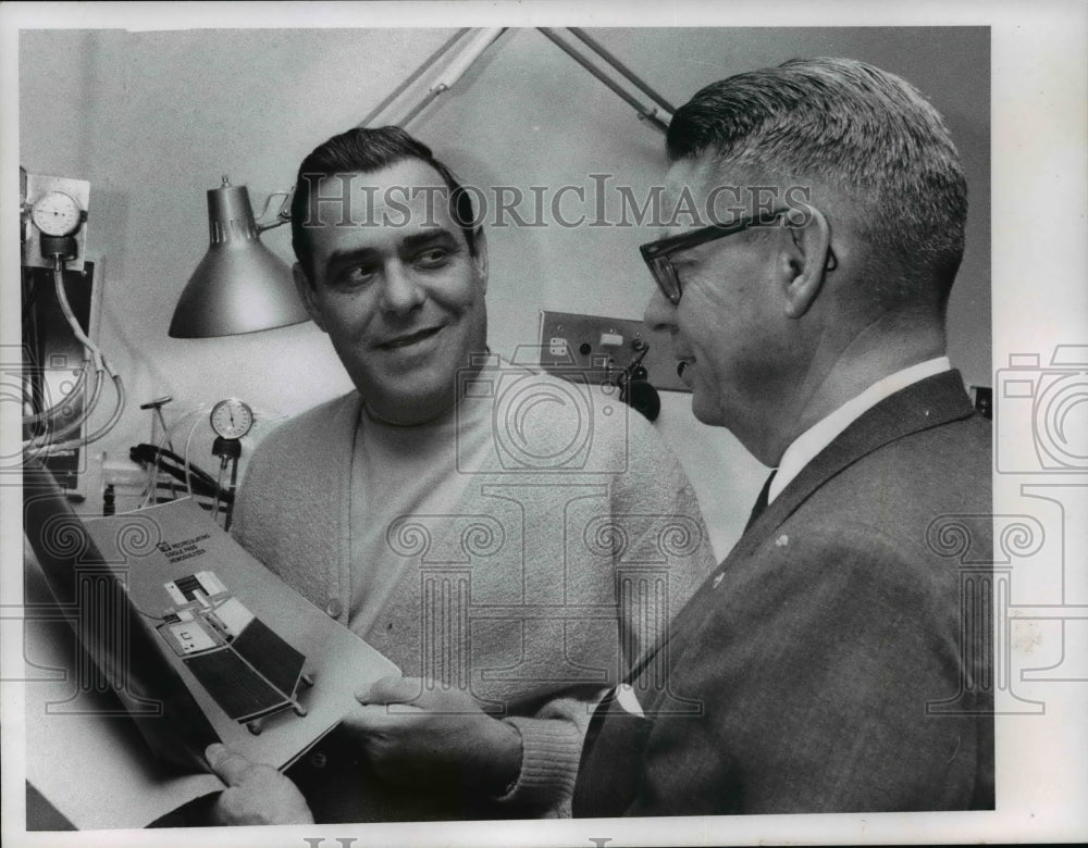 1968, Stanley Goldberg, 2460 Fenwick, kidney patient looks at picture - Historic Images