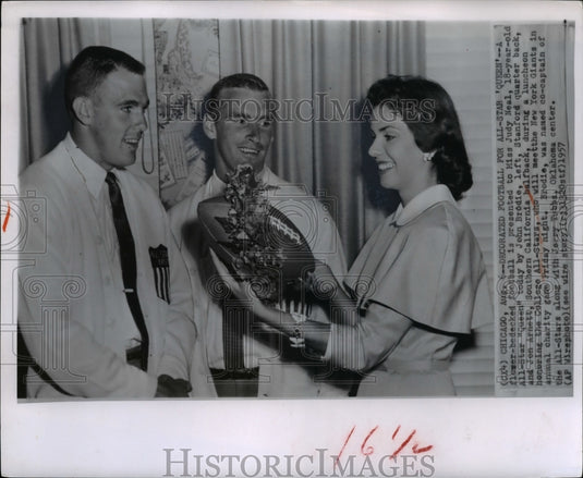 1957 Press Photo All Star "Queen" being presented a football by College Players. - Historic Images