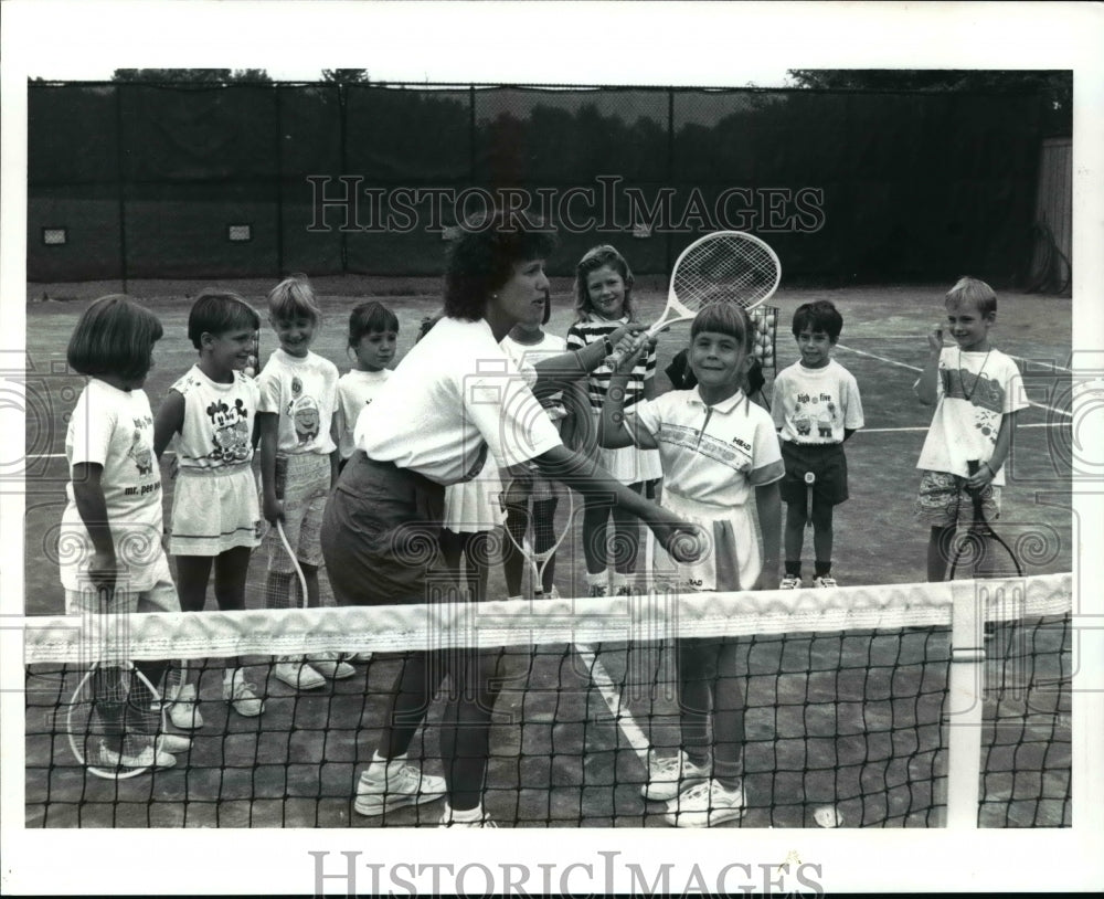 1991 Press Photo Mary Ginnard, teaches tennis to Jamie Arsianian - cvb61771 - Historic Images