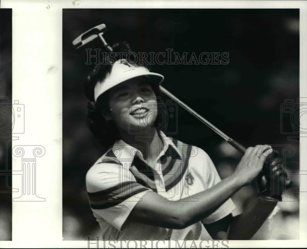 Press Photo Okamoto is all smiles after sinking a birdie putt on the 9th hole - Historic Images