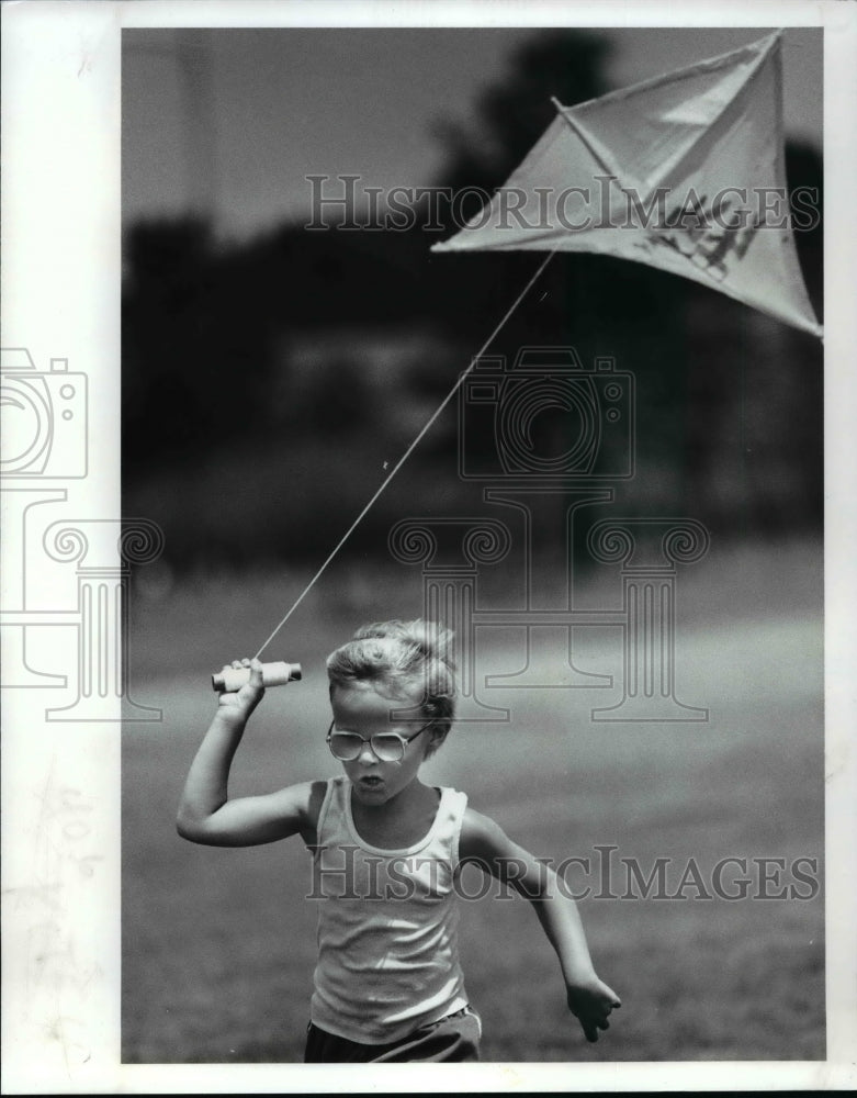 1989, 6 year old Eddie Williams flies his kite at Brookpark - Historic Images