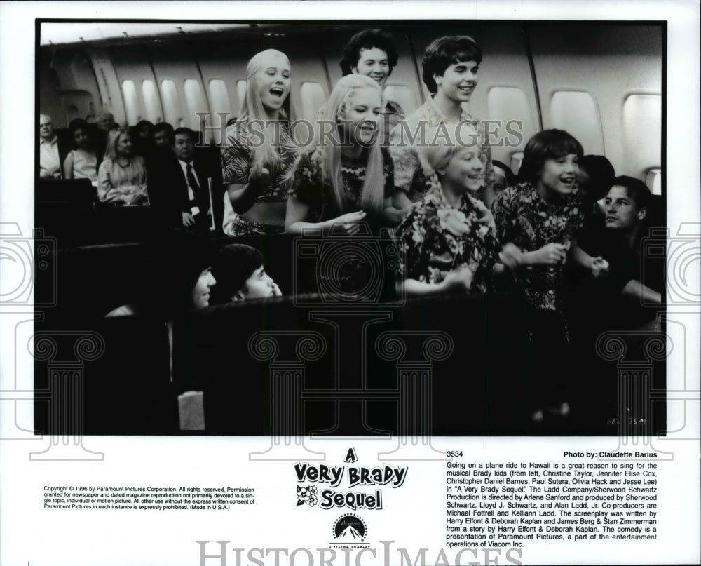 Press Photo Musical Brady Kids sings on a plane ride to Hawaii - Historic Images