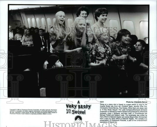 Press Photo Musical Brady Kids sings on a plane ride to Hawaii - Historic Images