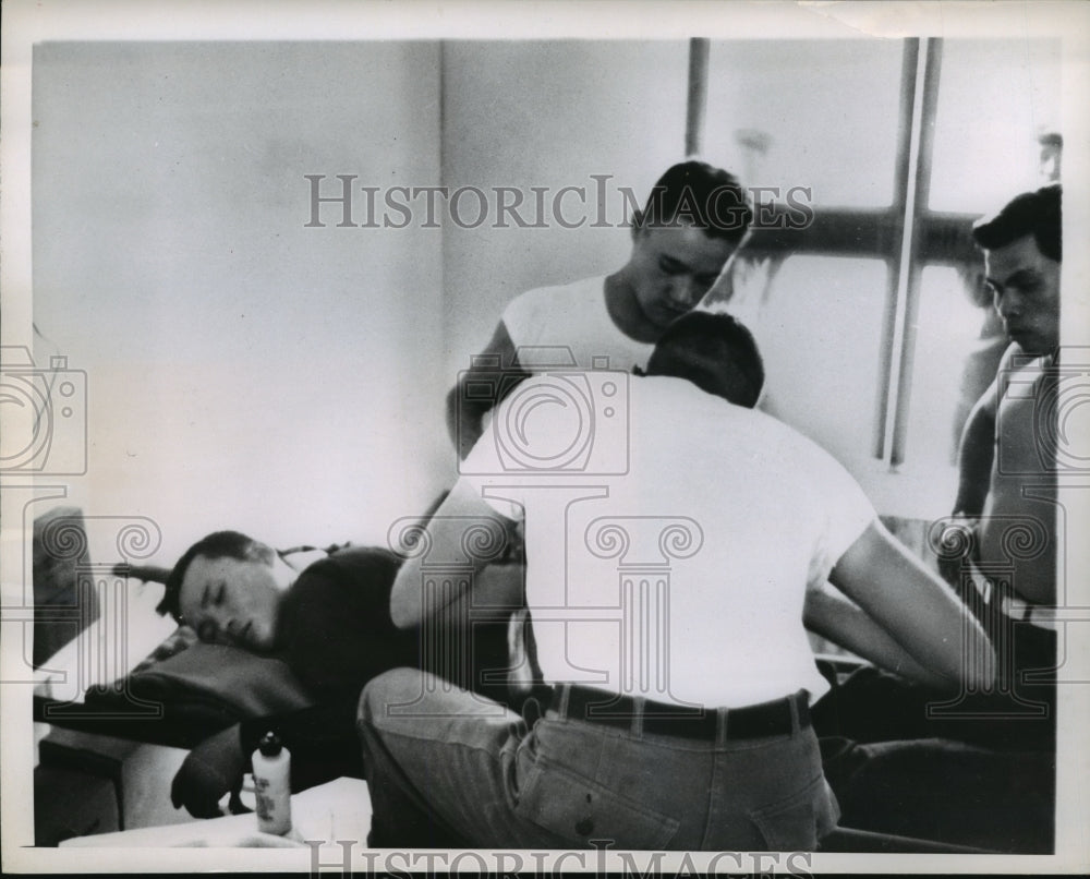 1962 Press Photo A wounded Viet Cong guerilla is treated by U.S. Army medics - Historic Images