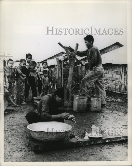 1967 Press Photo Health & sanitation officials digging a well in South Vietnam - Historic Images