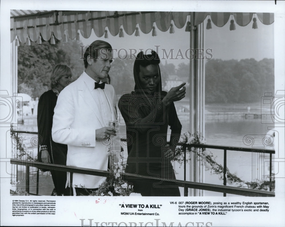 1985 Roger Moore & Grave Jones in A View to a Kill  - Historic Images