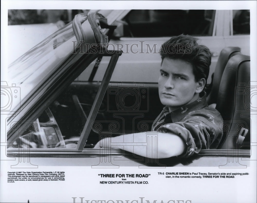 1987 Charlie Sheen as Paul Tracey in Three For the Road  - Historic Images