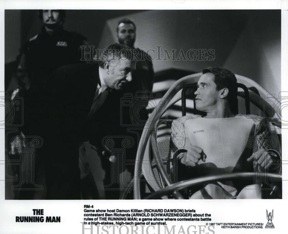 1987 Press Photo Richard Dawson and Arnold Schwarzenegger in "The Running Man" - Historic Images