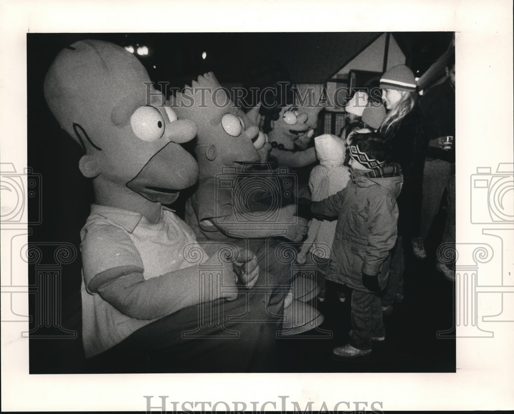 1990 Members of Simpsons at Public Square Skating Rink - Historic Images