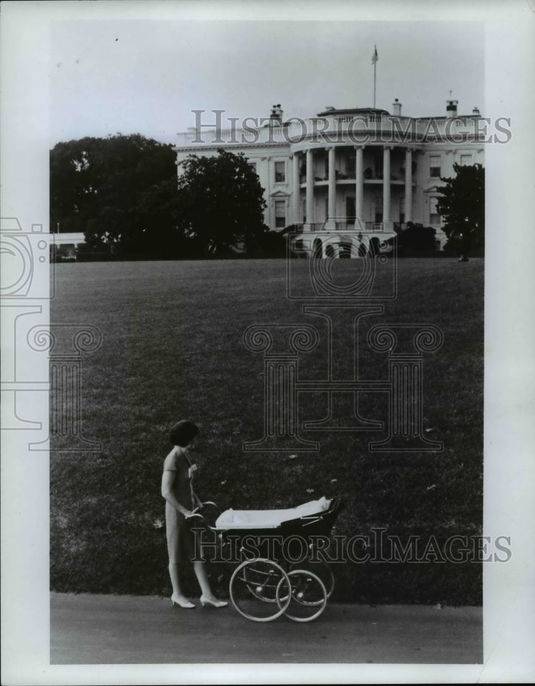 1967 Press Photo Lady Bird Johnson walks her grandchild at the White House. - Historic Images