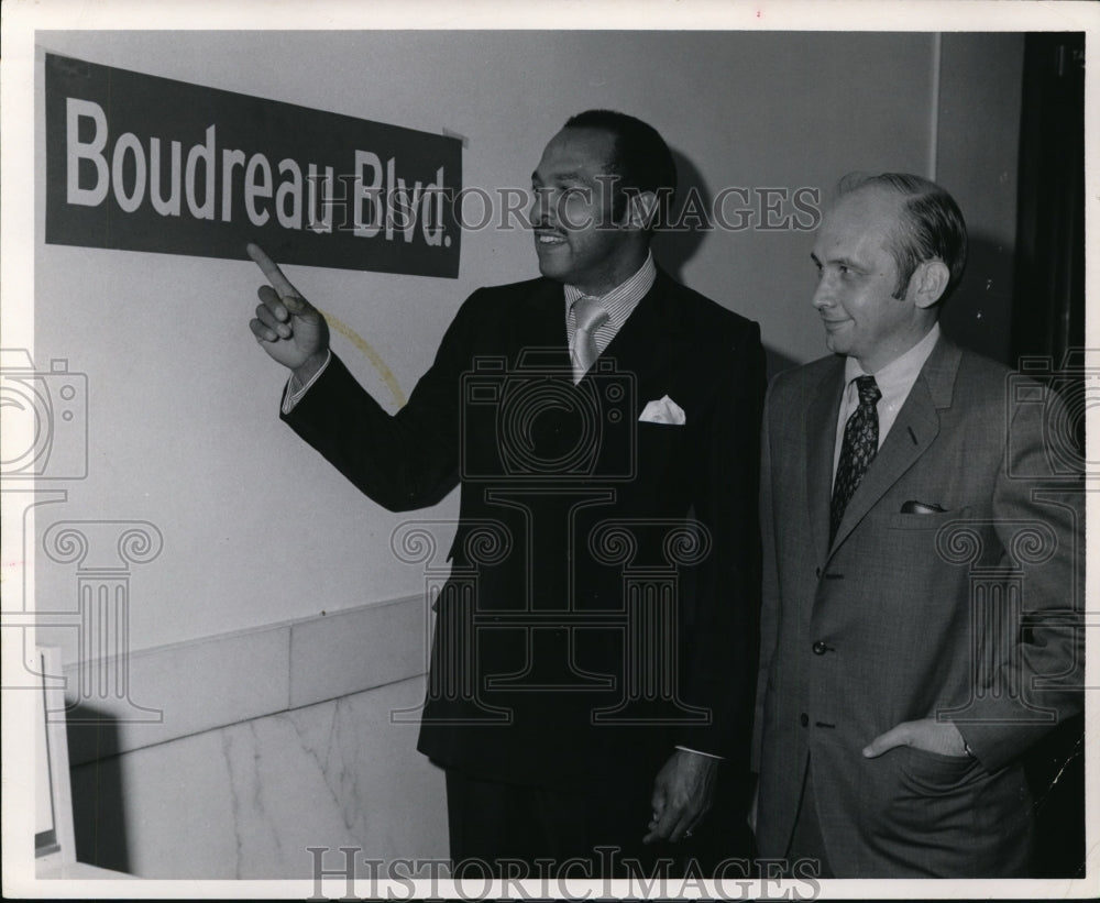 1970, Mayor Carl Stokes checks st sign named for Lou Boudreau - Historic Images