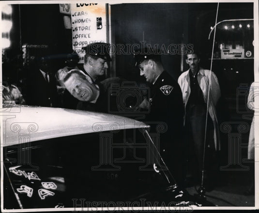 1964 Press Photo Patrolmen handcuff drunk in "The Mask", a police training film. - Historic Images
