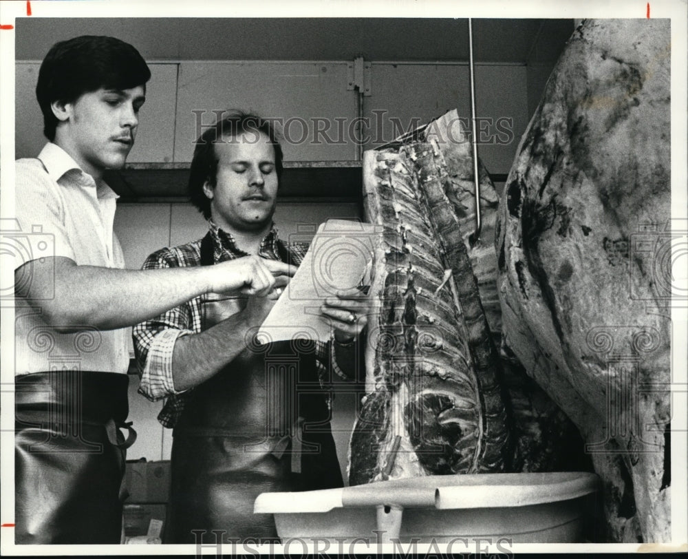 1981, Dave &amp; Mike Weaver checking meat in freezer - cvp90993 - Historic Images