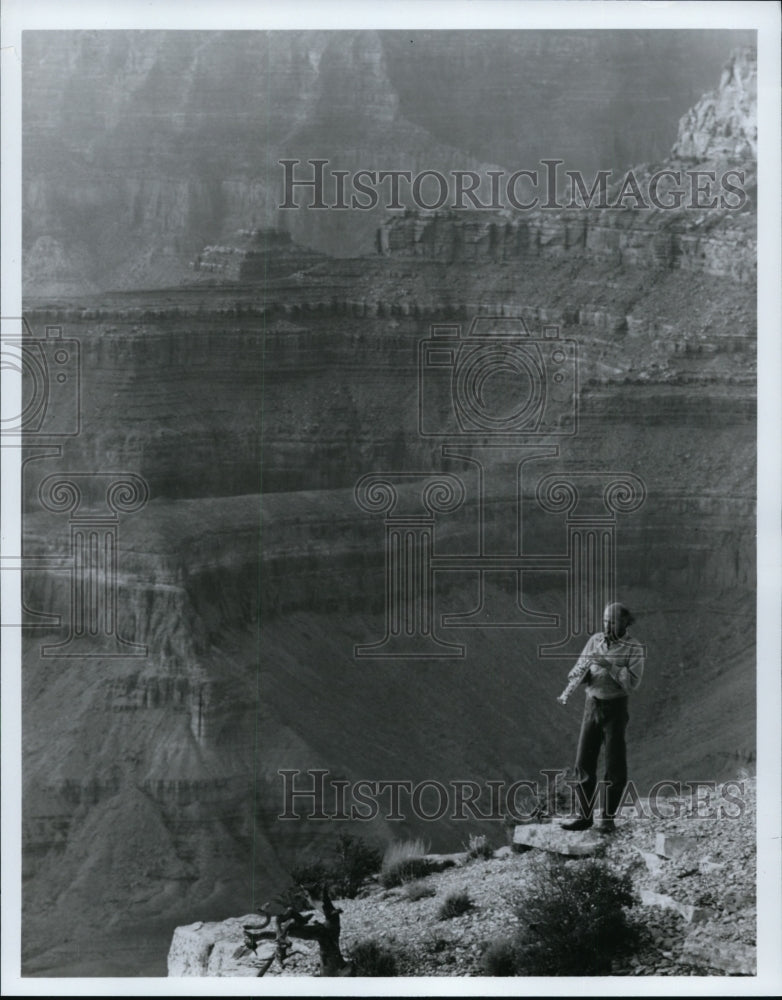 1985, Musician Paul Winter on the south rim of the Grand Canyon. - Historic Images