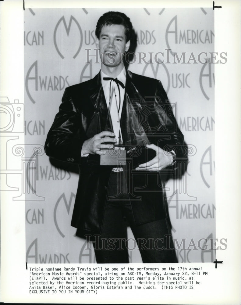 1990, Randy Travis performs at the American Music Awards. - cvp92207 - Historic Images