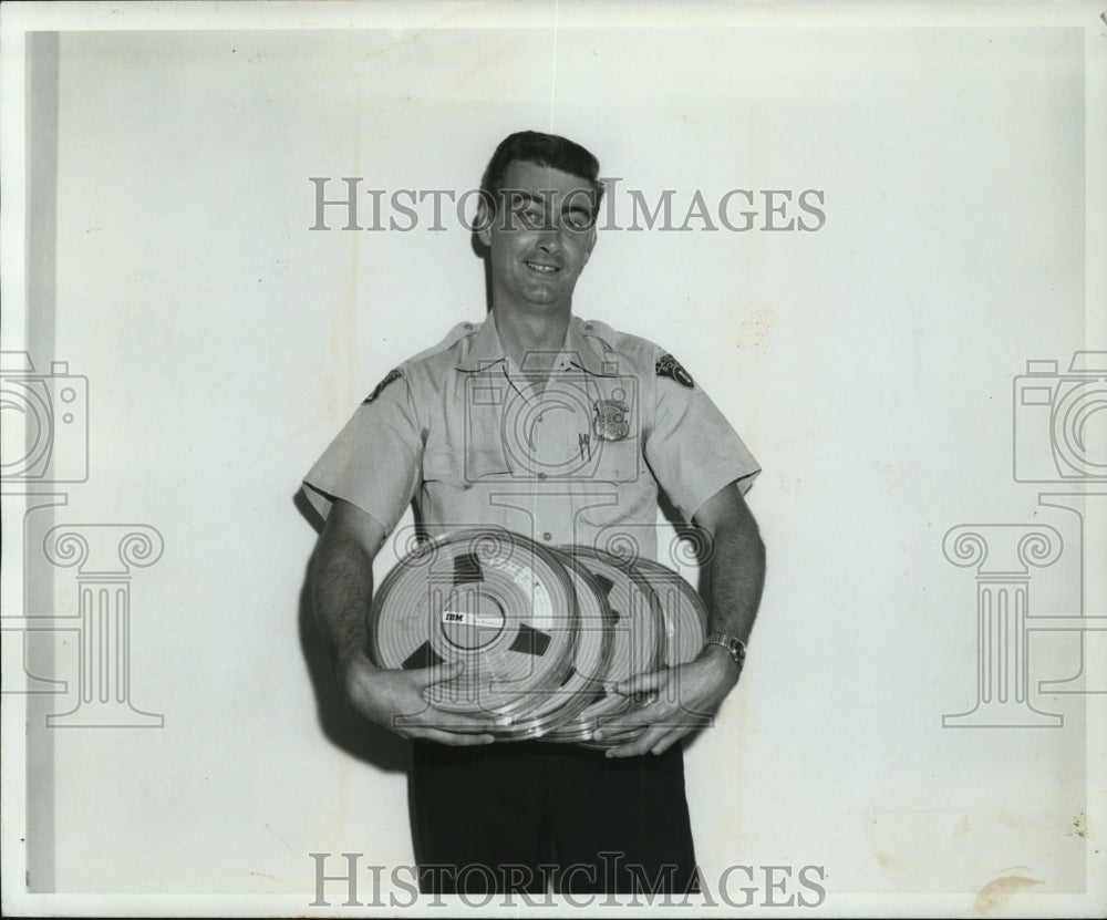 1964 Press Photo James Sands holds 100 foot rolls magnetic IBM tape - cvp93491 - Historic Images