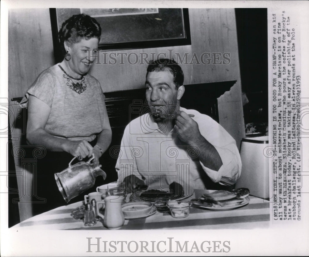 1953 Press Photo Rocky Marciano Enjoys Coffee from Mrs. Elizabeth Cousins - Historic Images