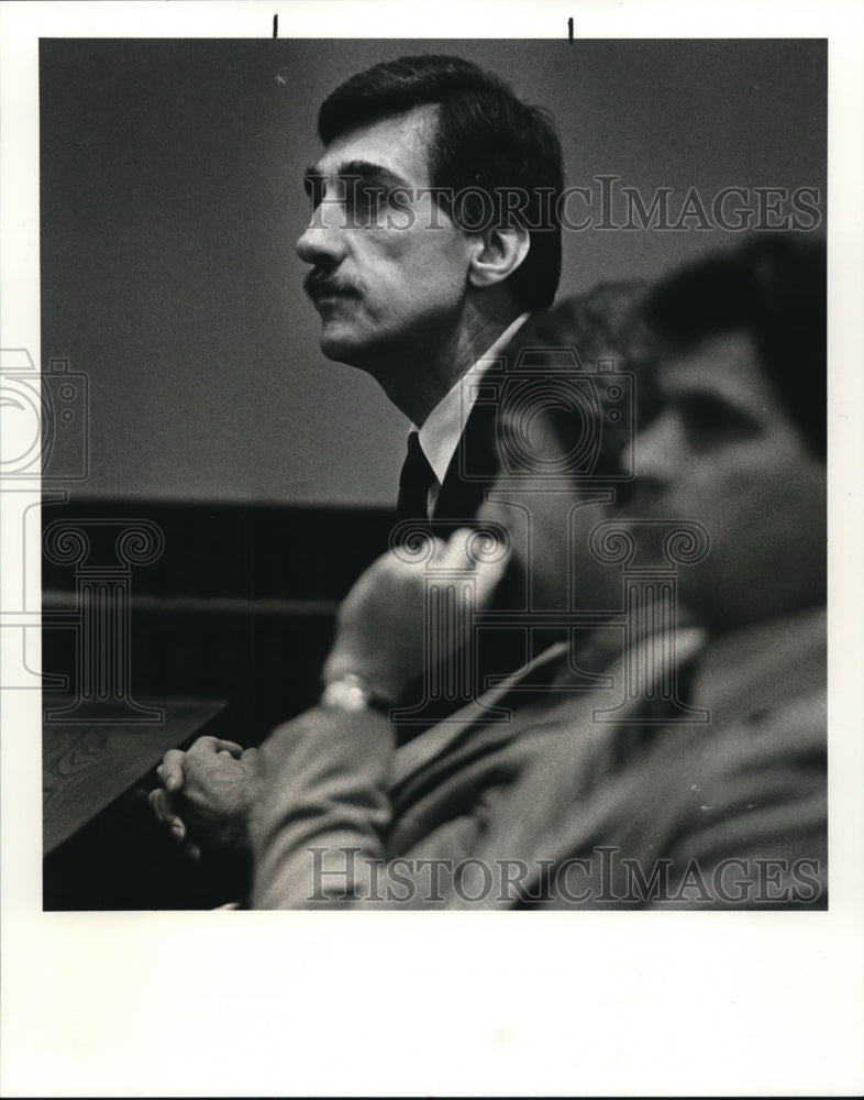 1984 Press Photo Robert Buell listens attentively as guilty verdicts on 8 counts - Historic Images