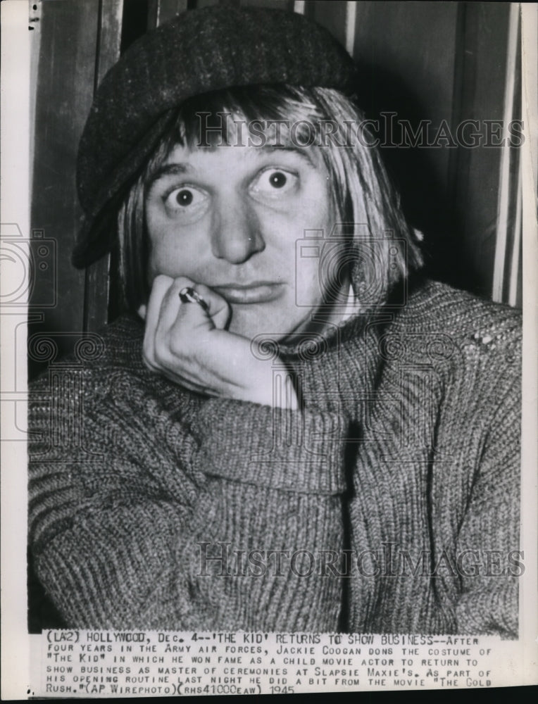 1945 Wire Photo After four years in the army air forces, Jackie Coogan dons - Historic Images
