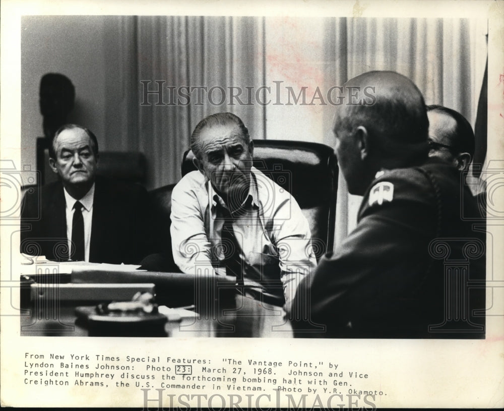 1988 Pres. Johnson with VP Humphrey as they discuss the bombing halt - Historic Images