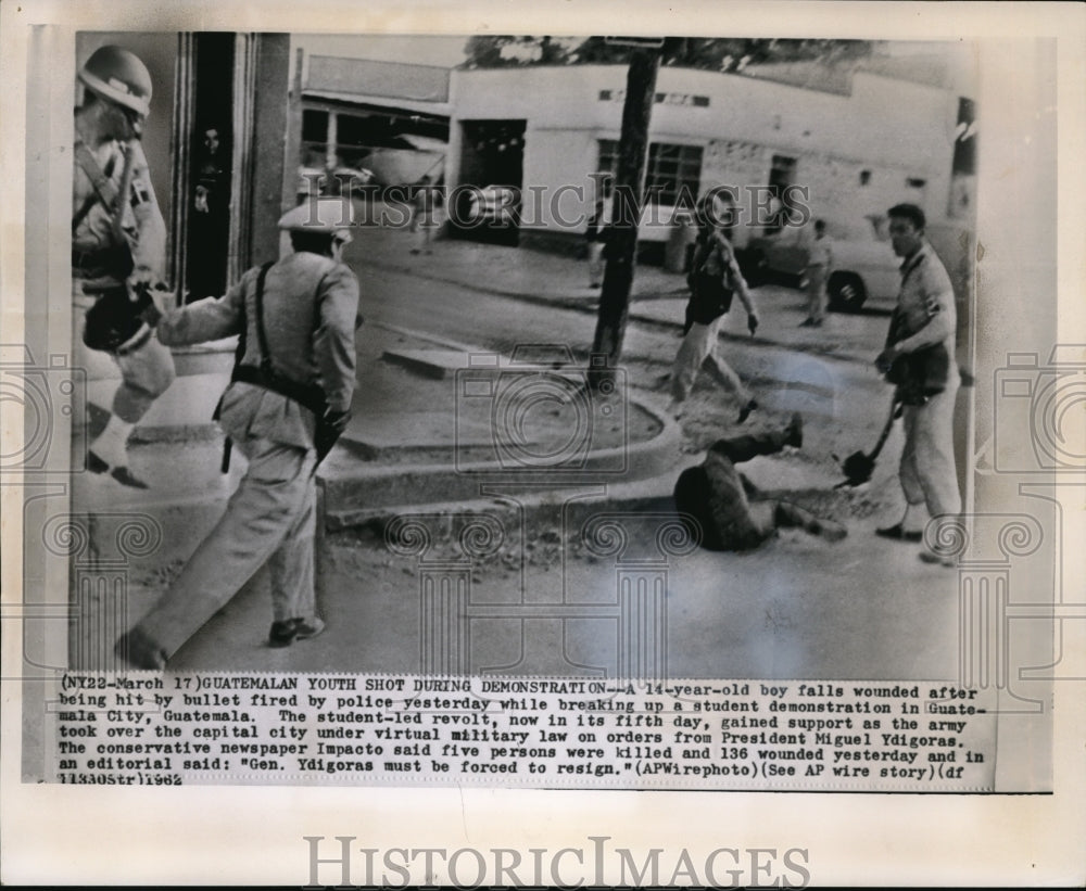 1962 Press Photo 14-year-old boy falls after being wounded in Guatemala - Historic Images