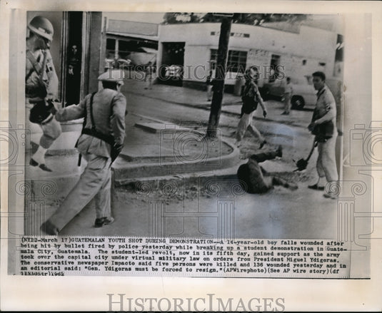 1962 Press Photo 14-year-old boy falls after being wounded in Guatemala - Historic Images