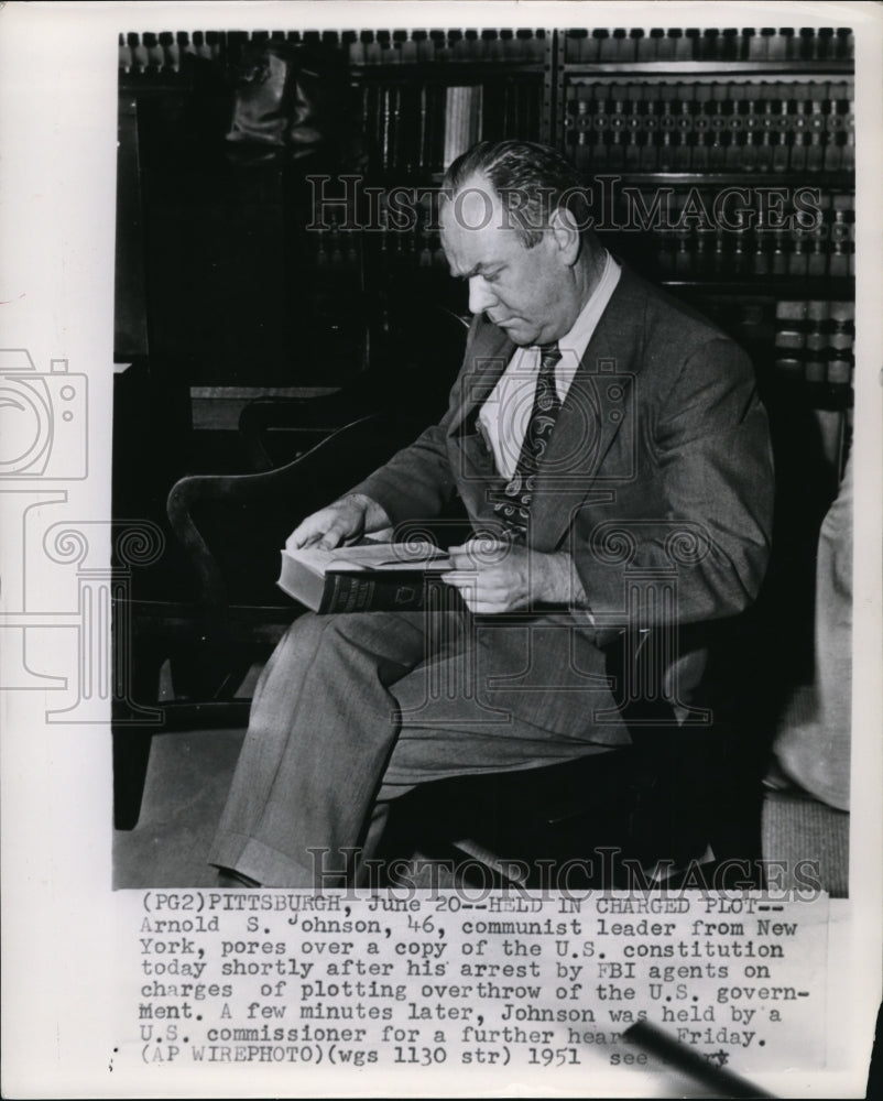 1951 Press Photo Arnold S. Johnson, communist leader from New York, pores over-Historic Images