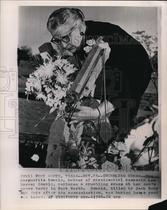 1964 Mrs. M Oswald Replaces a Crumbling Cross at her Son's Grave - Historic Images