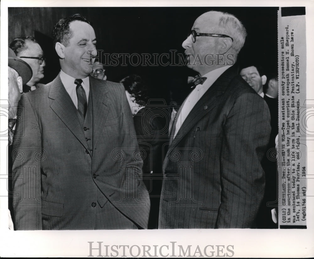 1954 Press Photo Two assistant county prosecutors smile in the courtroom after - Historic Images