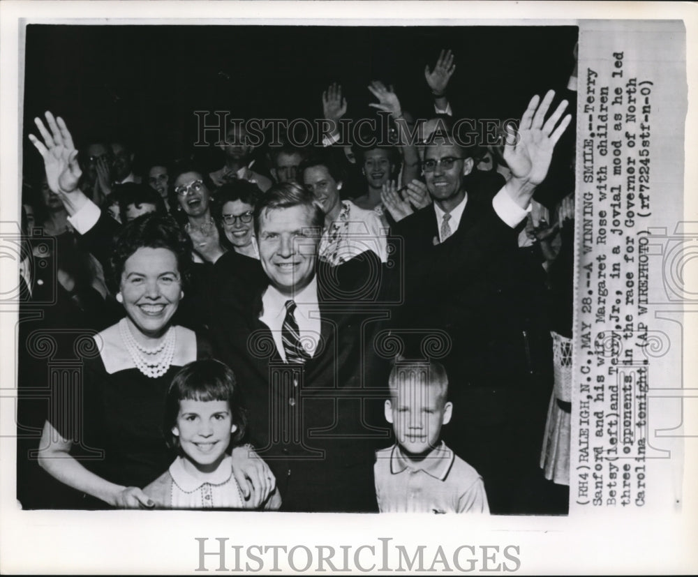 Wire Photo Sanford with his family in joy after leading the race of Governor - Historic Images