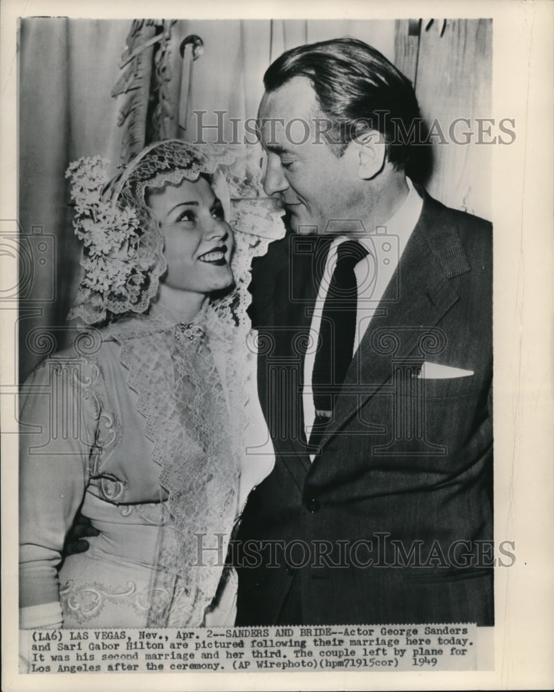 1949 Press Photo Actor George Sanders  and Sari Gabor Hilton in their wedding. - Historic Images