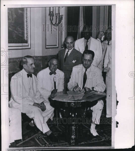 1946 Press Photo Clinton Anderson Signs Paper Covering Sale of Cuba's Sugar Crop - Historic Images