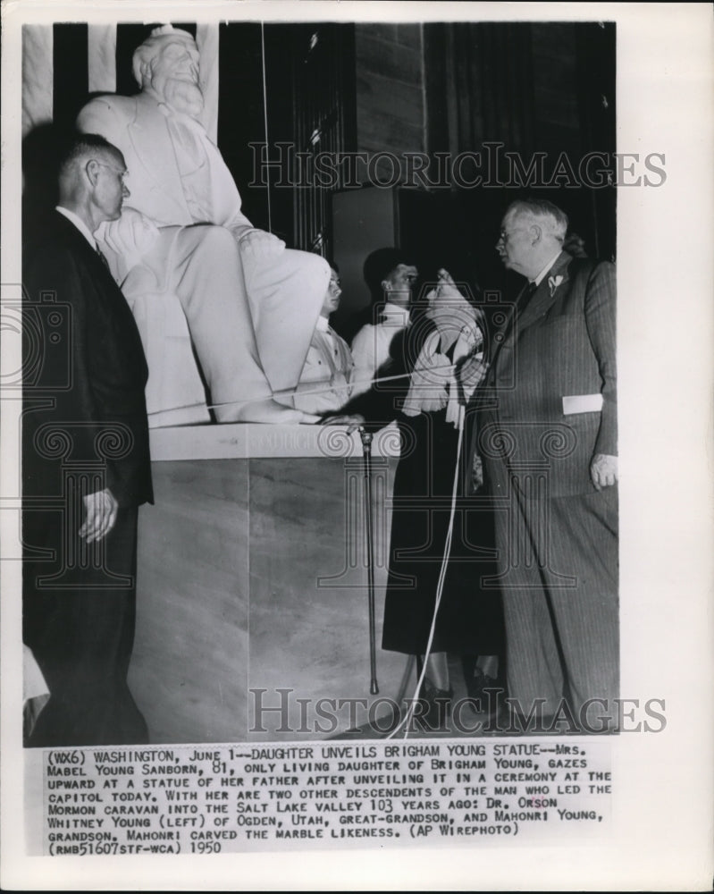 1950 Mrs. Mavel Young Sanborn Gazes Upward at a Statue of Her Father - Historic Images