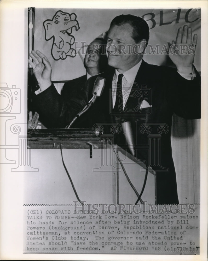 1962 New York Gov. Nelson Rockefeller raises his hands for silence - Historic Images