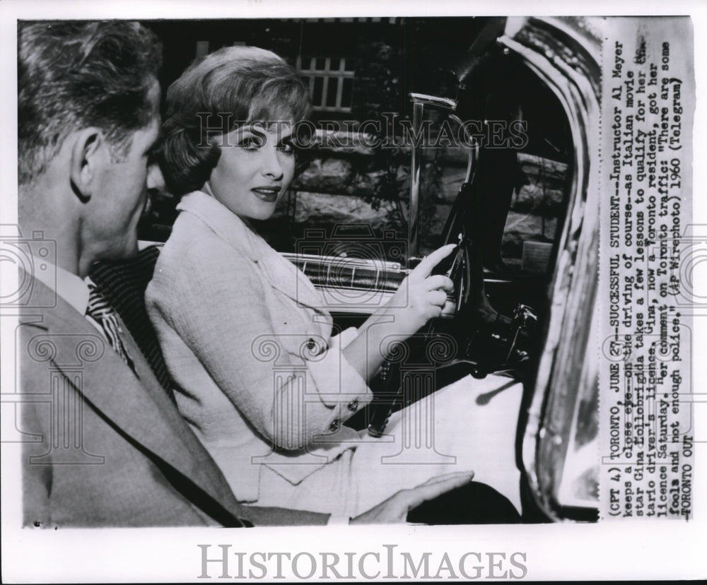 1960 Press Photo Instructor Al Meyer keeps a close eye--on the driving of course - Historic Images