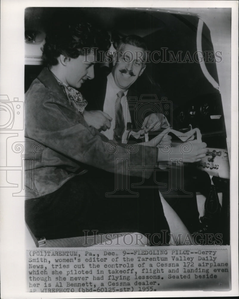 1955 Press Photo Gerry Smith tries out controls of Cessna 172 airplane - Historic Images